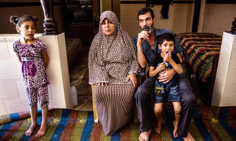 Mohamed Bakr and his wife Salwa with their children. The family lost one of their sons during the air strike on Gaza City's beach.