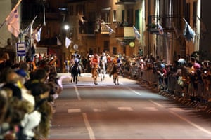 Riders compete in the Palio dei Ciuchi, or donkey race in Roccatederighi Grosseto, Italy