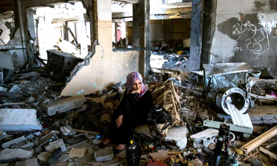 Adir Ali sits in her devastated flat in Beit Hanun, Gaza.