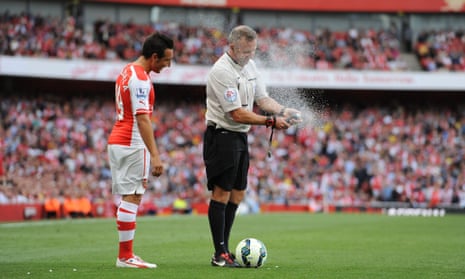 Referee Jonathan Moss gets into difficulty with his vanishing spray.