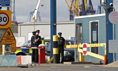 Policemen stand guard at Tilbury docks