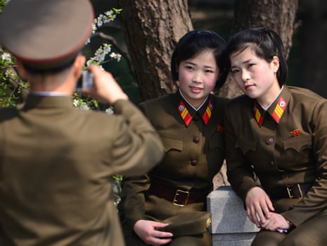 Members of the Korean People's Army pose for a photo near the site of late North Korean leader Kim Il-sung's house on 15 April, 2014, in Pyongyang, North Korea.