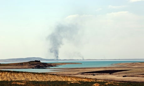 Smoke rises during air strikes targeting Islamic State militants at Mosul dam
