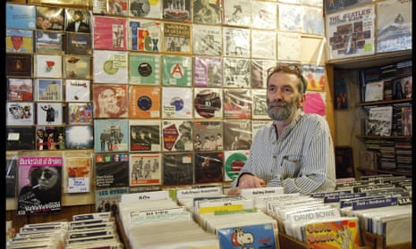 A shop assistant inside the Stand Out/Minus Zero record shop, Blenheim Crescent London