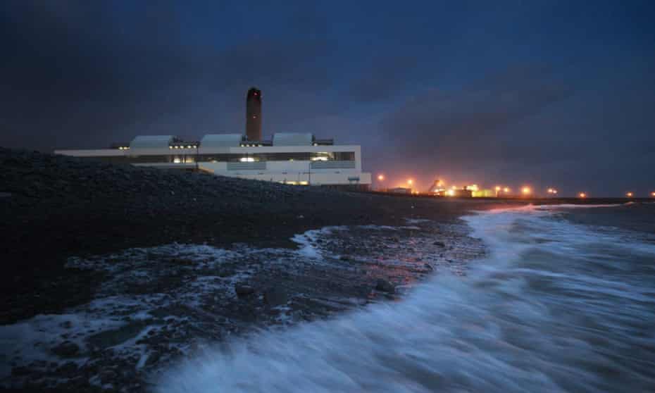 Waves crash onto the beach in front of Aberthaw power station near Barry, south Wales.