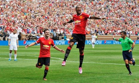 Manchester United's Ashley Young celebrates with Juan Mata after scoring their first goal.