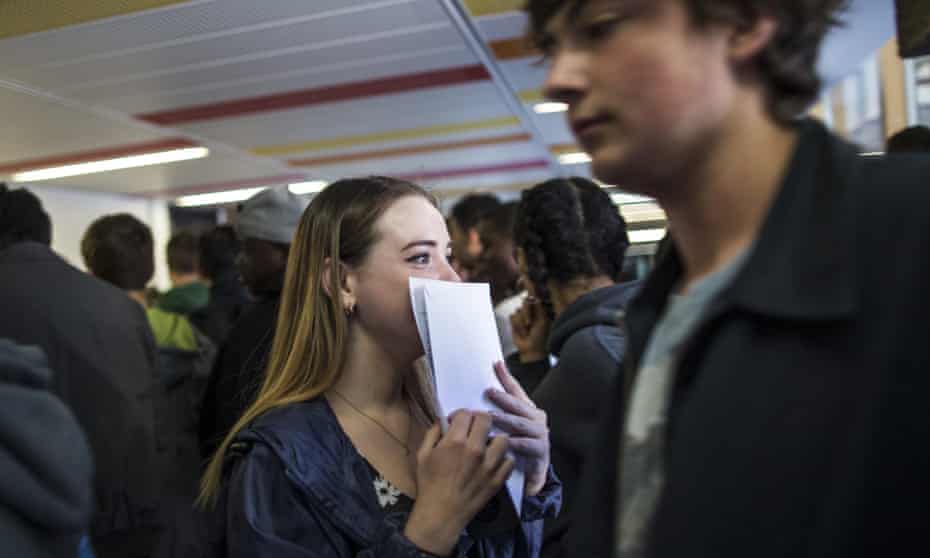 A girl reacts after opening her GCSE results at Stoke Newington school on August 21, 2014 in London, England.