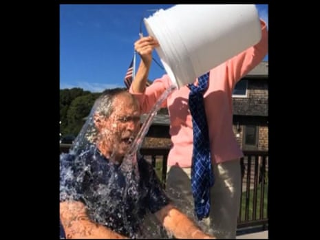 Former US president George W Bush being doused with ice water.