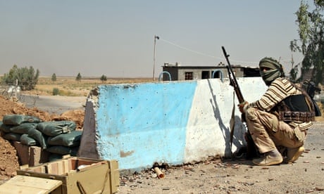 A Iraqi Turkmen Shia fighter holds a position in Amerli