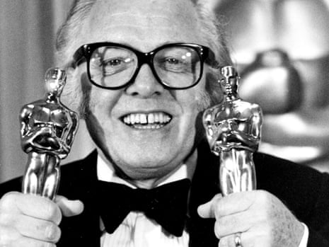 British actor and director Richard Attenborough holds his two Oscars for his epic movie "Gandhi".