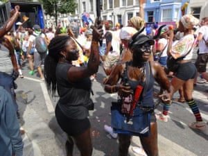 people dancing on the street during notting hill carnival