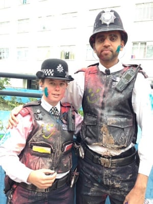two police officers covered in paint