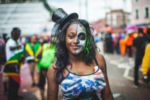 a woman with a painted face at the notting hill carnival