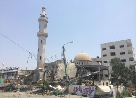 Al-Aqsa Martyrs mosque lies damaged after an air strike.