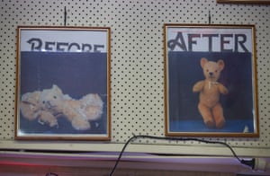 Photographs on the wall of the hospital show the before and after pictures of a doll brought in for repair.
