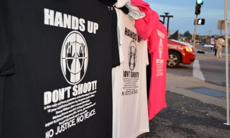 T-shirts on sale from a street vendor that bear the message "Hand up, don't shoot" in reference to the shooting dead of 18-year-old Michael Brown by a police officer in Ferguson, Missouri on August 9th, 2014.