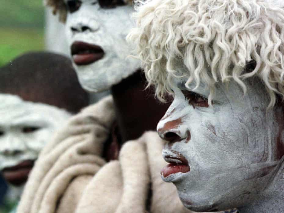 Abakhwetha, the Xhosa word for initiates, near the Eastern Cape Province town of East London, South Africa. With white clay covering their faces as a symbol of purity, they wear sheepskins to protect them from the cold, as they near the end of their ritual initiation into manhood.