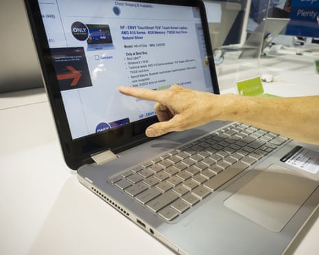 A shopper inspects an HP laptop computer in a Best Buy electronics store in New York.