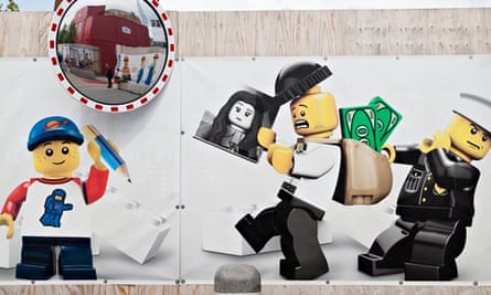 Lego characters adorn the fencing around the site of the new Lego House in Billund, Denmark