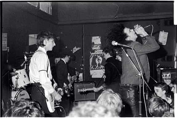 The Birthday Party (visible: Rowland S Howard, Tracy Pew, Mick Harvey and Nick Cave) photographed at the Moonlight Club, West Hampstead, by Bleddyn Butcher on 26 October 1981