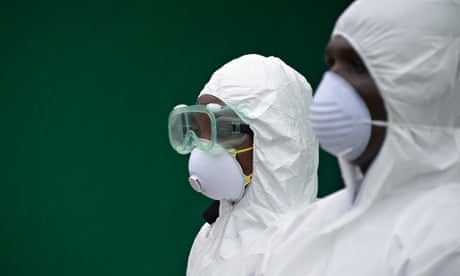 Health workers conduct an Ebola prevention drill at the port in Monrovia, Liberia.