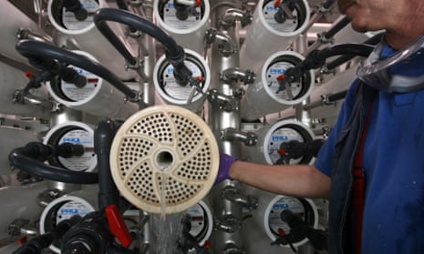 Senior Plant Operator waits as water is used to push a membrane out from a pressure vessel in the Reverse Osmosis facility, which is part of the Groundwater Replenishing System in Orange County Water District, in Fountain Valley, California. The Reverse Osmosis System removes salts, viruses and pharmaceuticals from the water.
