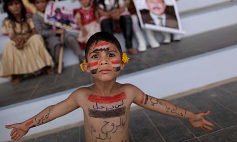 A Yemeni boy painted with the colours of his national flag.