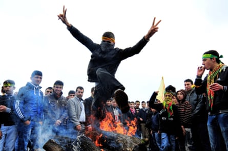 A Turkish Kurd jumps over a fire during a gathering to celebrate Noruz, the Kurdish New Year, in Istanbul in 2011.