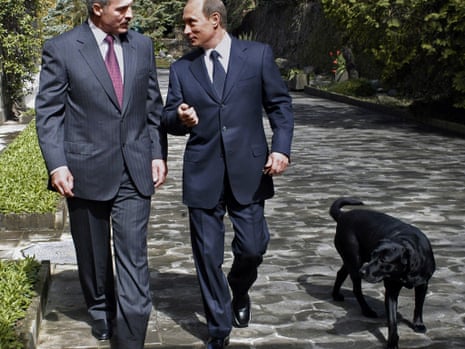 Russian President Vladimir Putin, right, speaks with his Belarus counterpart Alexander Lukashenko as they walk with Putins' Labrador, Koney, during their meeting at Putin's vacation residence in Sochi, Russia, a Black Sea resort, Monday, April 4, 2005. Lukashenko is on a visit to Russia. (AP Photo/ ITAR-TASS/ Presidential Press Service)