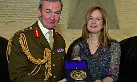 Holly Davies receives her British Empire Medal from Chief of the Defence Staff, Sir Nick Houghton