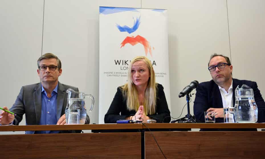 (L-R) General Counsel or the Wikimedia Foundation, Geoff Brigham; Wikimedia Foundation Chief Executive, Lila Tretikov and Wikipedia co-founder, Jimmy Wales, attend a press conference in central London on August 6, 2014 ahead of the Wikimania conference.
