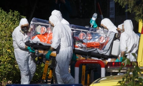 Health workers wheel a stretcher into a hospital with one of two Spaniards repatriated from Liberia, who has tested positive for the Ebola virus.