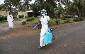 A nurse with a spray disinfectant at the ELWA Hospital where a US doctor Kent Bradley contracted the Ebola virus in Monrovia, Liberia.