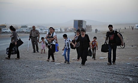 Thousands of Yazidi and Christian people flee to Erbil after the latest wave of Isis advances