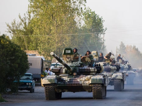 A convoy of Azerbaijan's army tanks moves in the direction of Agdam, Azerbaijan, on 2 August. Recent days have seen a sharp escalation in fighting around Nagorno-Karabakh.