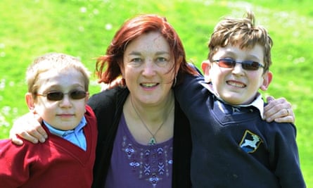 Archie Eaton,13, and his brother Isaac, 11, with mum Anna.  