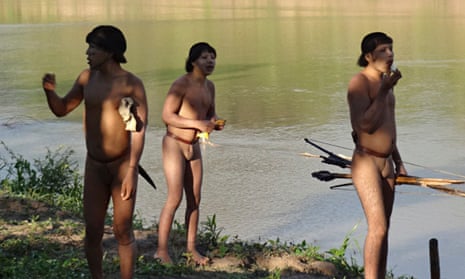 Three members of a previously uncontacted tribe make contact with a team of researchers in Brazil