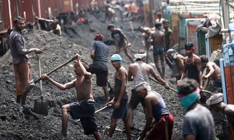 Indian labourers load coal into trucks at a coal warehouse in Bari Bharmana railway station about 20 Km from the northern city of Jammu, India, 23 August 2012. India's opposition lawmakers disrupted Parliament sessions on the past two days and demanded Premier Manmohan Singh's resignation following a report that the country lost 33 billion dollars by allocating coal mine licenses instead of auctioning them.