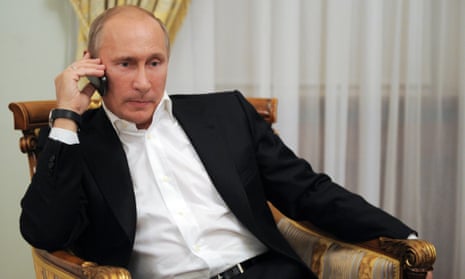 Russia’s President Vladimir Putin on his phone.