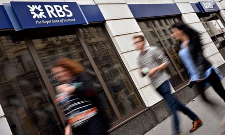 People walk past a branch of The Royal Bank of Scotland in central London