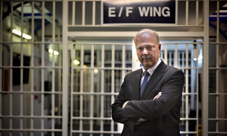 Chris Grayling visiting a prison. Questions have been raised about contracts drawn up by his departm