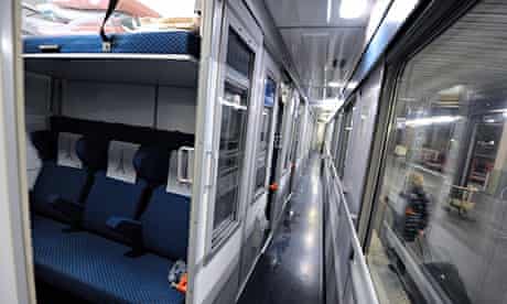A picture shows a cabin and a corridor of a Thello train, of French Veolia Transdev and Italian Thre