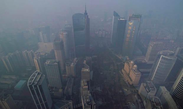 Buildings are seen through thick haze at the central business district in Guangzhou
