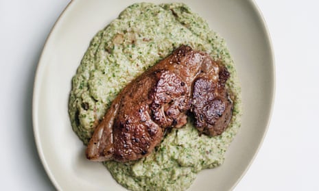 Lamb steak with creamed cannellini on a round plate