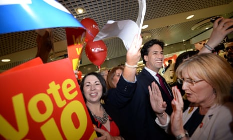 Ed Miliband makes his way through St James Shopping Centre in Edinburgh as shadow Scottish secretary Margaret Curran pushes demonstrators and supporters back