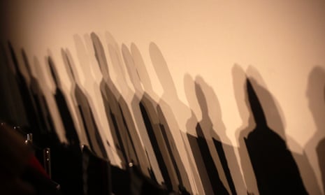 Shadows of members of a panel are seen on a wall before a meeting about the "right to be forgotten"