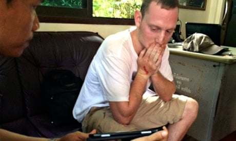 British tourist Christopher Ware is questioned by a Thai police officer on Koh Tao island.