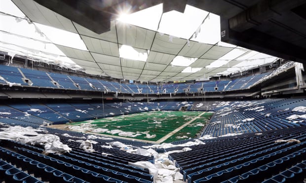 Interior of the Pontiac Silverdome: the venue is a shell of its former self with its roof in tatters.