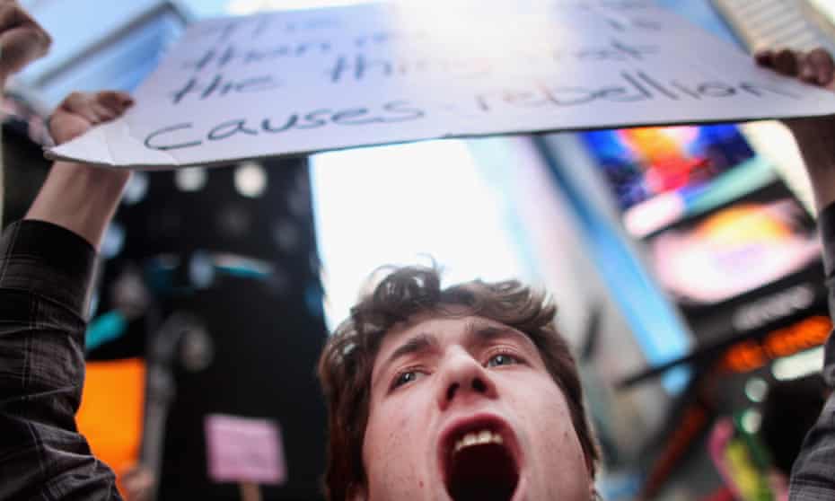A demonstrator shouts in Times Square.