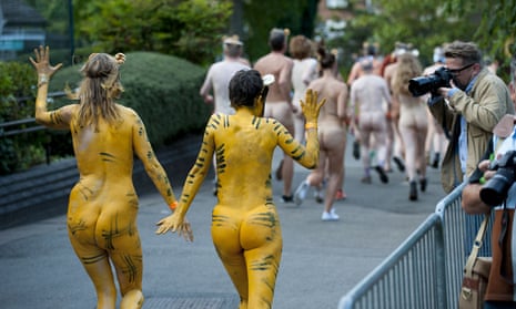 Streak for tigers … runners in body paint raise money for conservation at London zoo.